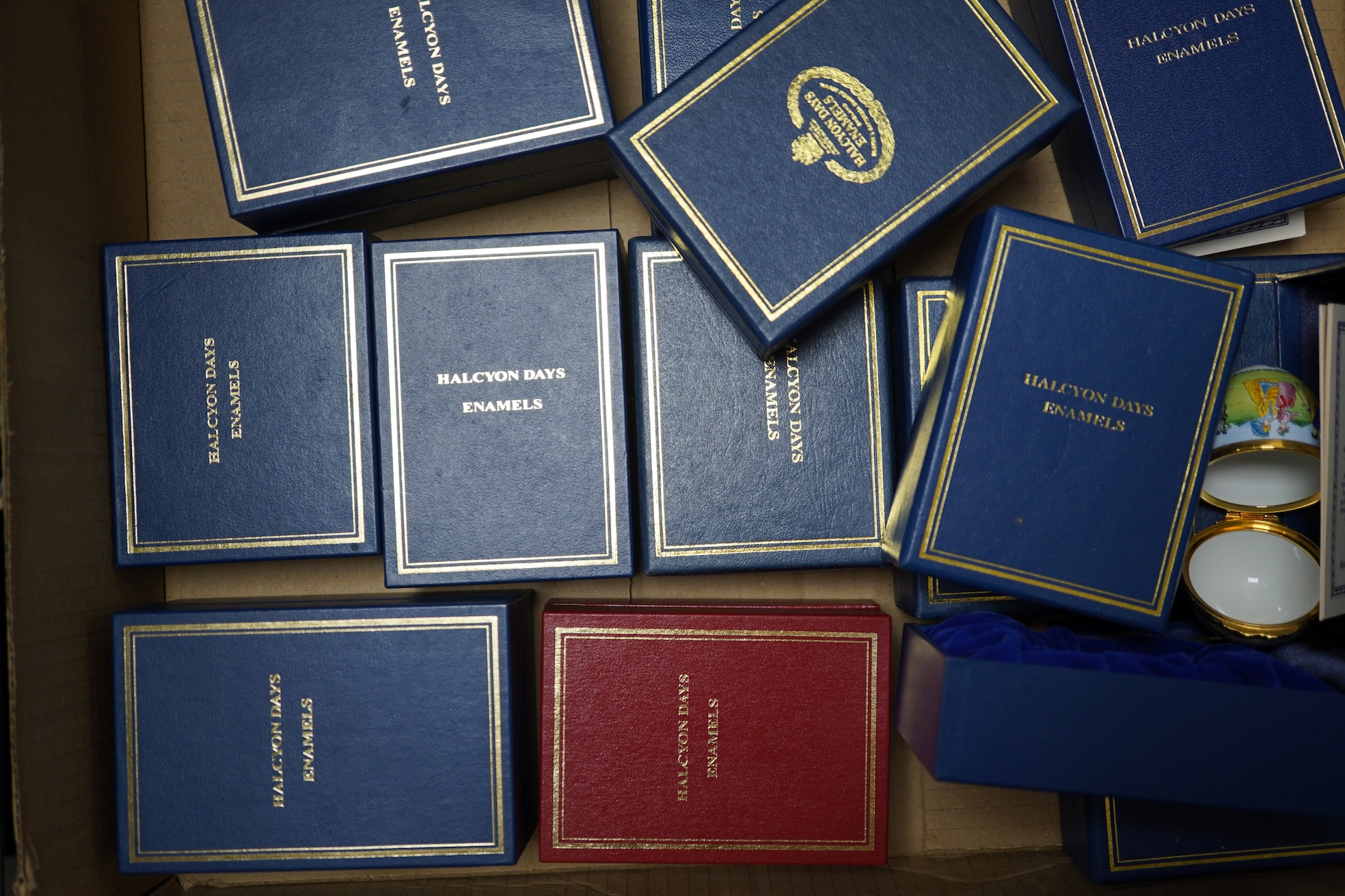 A collection of fourteen boxed Halcyon Days enamel trinket boxes, boxed